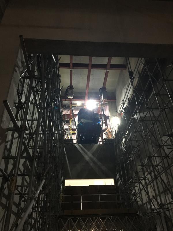 Limited access gantry hoist, lowering generators & ancillary equipment to basement