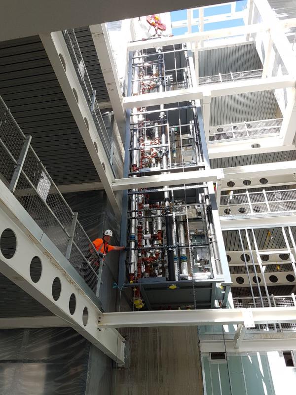 Lowering a modified riser into position at Kings Cross